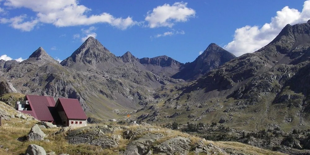 Refugio Respomuso mountain refuge surrounded by high peaks in the Valle de Tena, Spanish Pyrenees